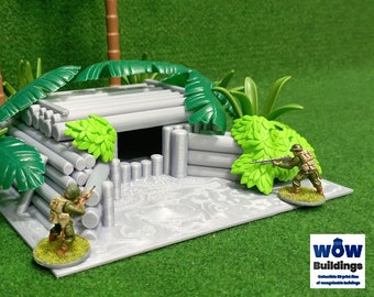 May include: A gray plastic model of a log cabin bunker with a green plastic roof. Two miniature plastic soldiers are standing near the bunker. The bunker is surrounded by green plastic foliage. The text "WOW Buildings" is visible in the lower right corner of the image.