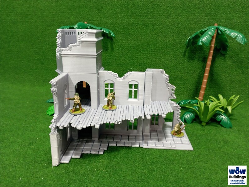May include: A gray, ruined building with a collapsed roof and a tower. The building is made of plastic and is designed for use in tabletop wargames. There are small plastic figures of soldiers standing in the building.