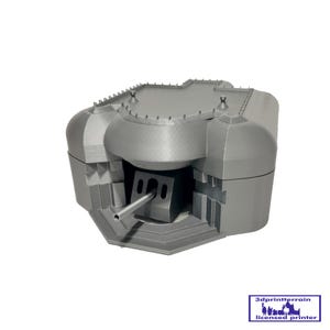 May include: A grey 3D-printed model of a military bunker. The model features a gun turret and detailed architectural elements. The bunker is designed with a flat roof and multiple openings. The model is likely for tabletop gaming or display.