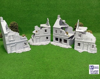 Puede incluir: Cuatro estructuras de edificios en ruinas impresas en 3D de color gris con pequeñas figuras de plástico verde de pie en la parte superior de los edificios. Los edificios están sobre una superficie de césped artificial verde. El texto "3d print terrain" está en la esquina inferior derecha de la imagen.
