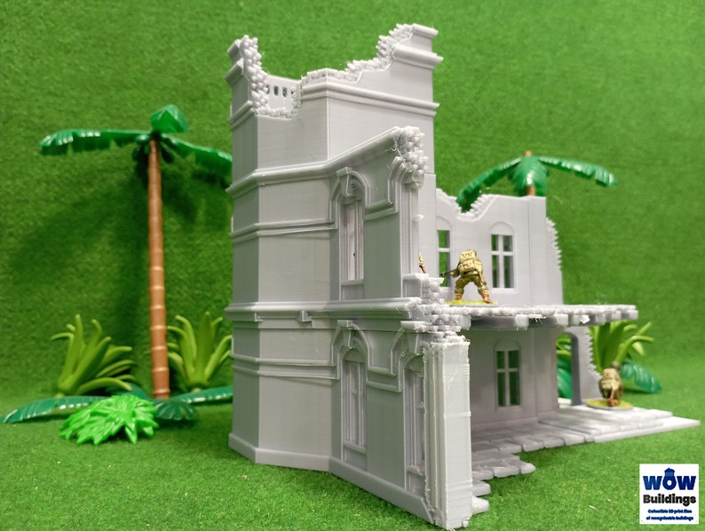 May include: A detailed, gray, 3D printed model of a ruined building with a balcony and a palm tree in the background. The building has a broken window and a collapsed roof. The model is made by WOW Buildings.