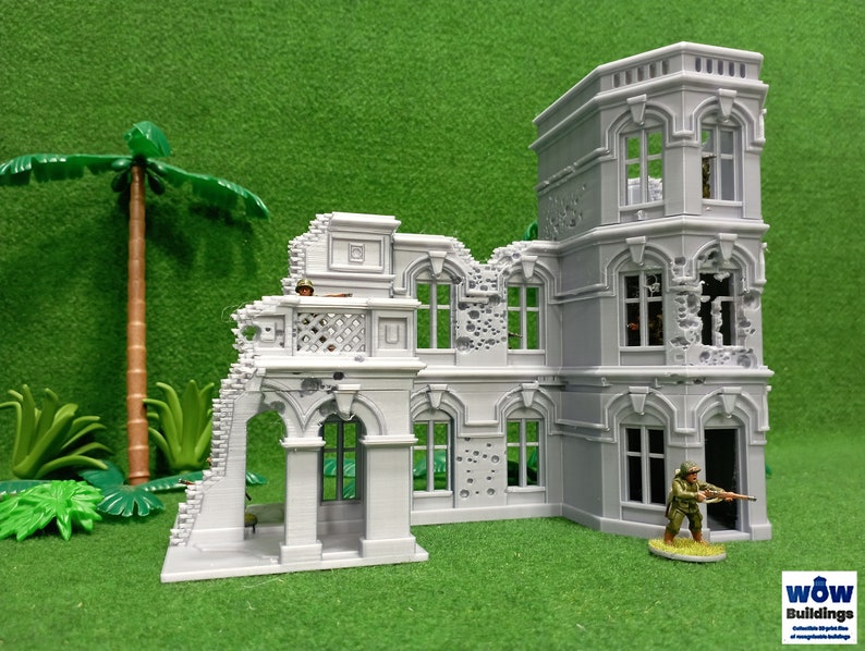 May include: A gray, detailed, multi-section model of a ruined building with a tower. The building has arched windows, a balcony, and a doorway. The model is set against a green background.