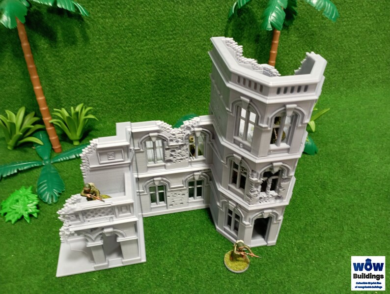 May include: A gray, detailed, multi-sectioned, ruined building model with a tower. The model is made of plastic and has a realistic, weathered look. The building is set against a green background.