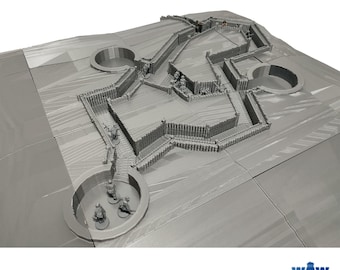 May include: A gray 3D printed model of a World War I trench system with multiple trenches, walkways, and bunkers. The model includes small figures of soldiers in the trenches.