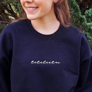 Tetelestai Embroidered Crewneck Sweatshirt | John 19:30 It Is Finished Christian Apparel Black Calligraphy Greek Typography Sweatshirt