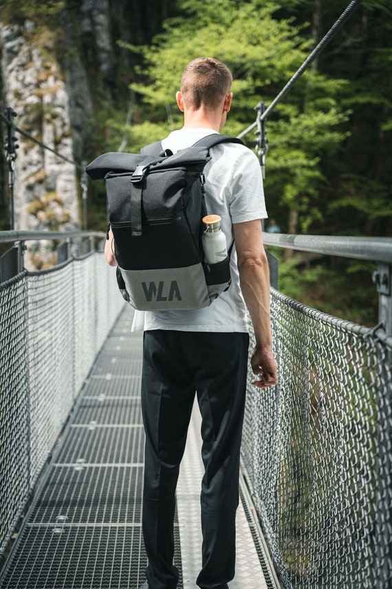 Large rolltop backpack with chest strap and wet compartment, water-repellent, black-grey