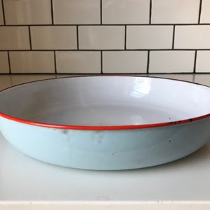 Palest blue enamelware tray with cherry red trim