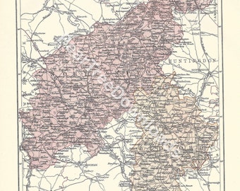 May include: A vintage map of the counties of Northampton and Bedford in England. The map is printed in black and red ink on a cream-coloured background. The map shows the counties' boundaries, major cities, towns, and rivers. The map is titled "Northampton & Bedford" and is labelled "Plate XVII."