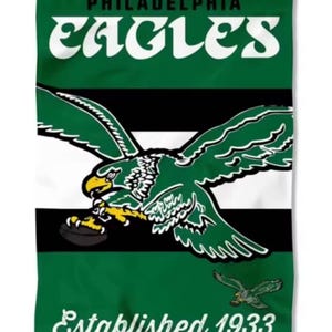 May include: Green Philadelphia Eagles garden flag with the team name in white arched text at the top. The flag features the team's logo, an eagle holding a football, and the text "Established 1933".
