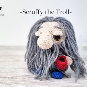 May include: Crochet pattern for a gray troll with a red cup, titled "Scruffy the Troll - PDF Pattern".