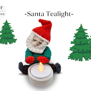May include: Crocheted Santa Claus holding a white tealight holder. The Santa is wearing a red hat, white beard, green sweater, and red mittens. The tealight is lit and glowing. The background is white with two green pine trees.
