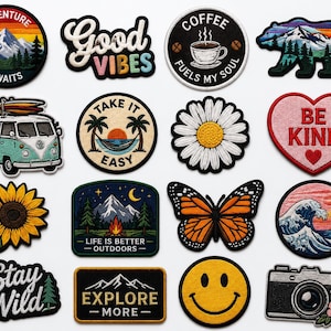 May include: A collection of sixteen embroidered patches featuring various designs including a mountain landscape with text Adventure Awaits, a Good Vibes script, a coffee cup, a bear silhouette, a camper van, a hammock, flowers, a heart with Be Kind, a butterfly, a wave, a camera, and a smiley face.
