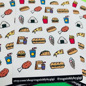 May include: White stickers featuring hand-drawn illustrations of fast food items such as burgers, fries, pizza, tacos, and ice cream cones. The stickers include the text "etsy.com/shop/roguishlybygigi @roguishlybygigi".