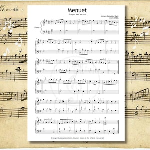 May include: Sheet music for piano featuring the composition "Menuet" by Johann Sebastian Bach. The music is printed on a white page with black notes and text, set against a vintage paper background. The title and composer's name are clearly visible.
