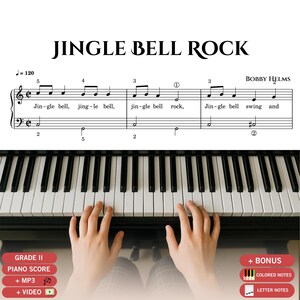 May include: A piano score for "Jingle Bell Rock" by Bobby Helms, with the title at the top. The image shows piano keys and hands playing. Text includes "GRADE II PIANO SCORE" and "+ MP3 + VIDEO".