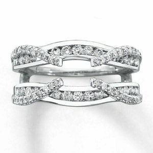 May include: A silver ring enhancer with a delicate, twisted design. The enhancer is set with small, sparkling diamonds.