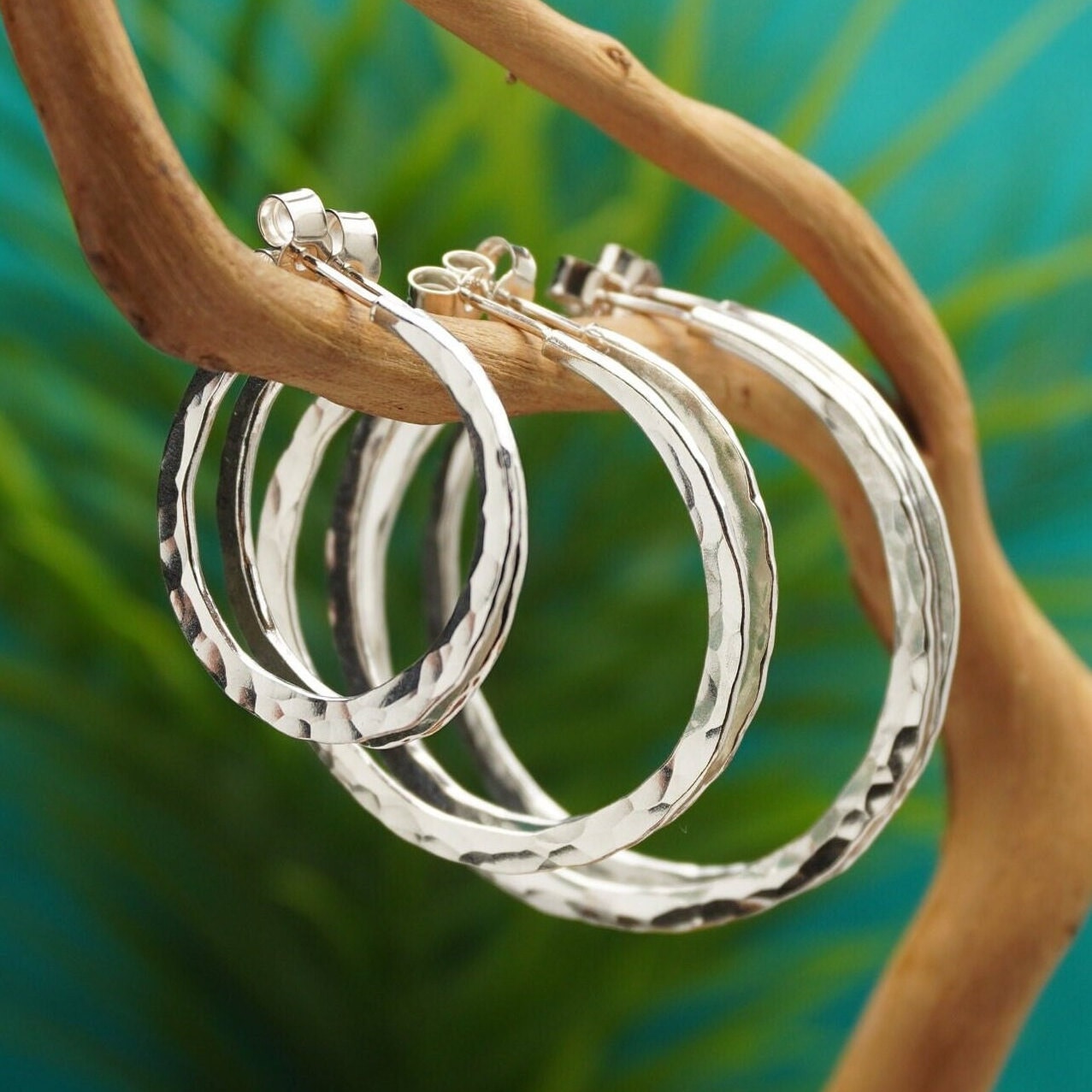 Silver hoops with shop butterfly back