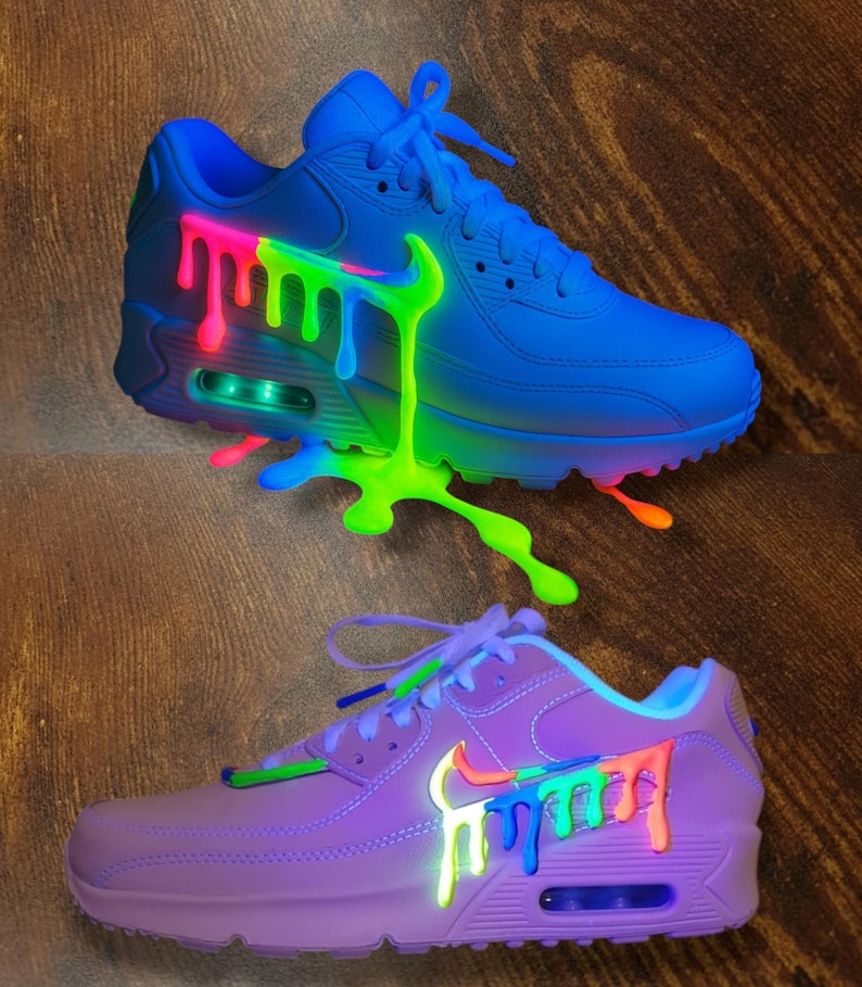 May include: A white ceramic mug with a black handle and the text "But First, Coffee" in a bold, black font. The mug is set against a blurred background, suggesting a cozy setting.