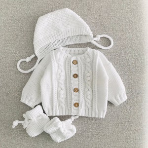 Adorable Knitted Baby Cardigan Set: White and Cozy with Hat and Booties Baby coming home outfit image 1