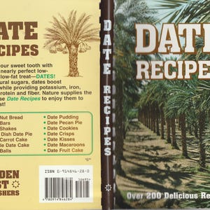May include: A cookbook titled "Date Recipes" with a brown cover. The cover features the title in large white letters, a palm tree illustration, and a list of date-based recipes. The book promises over 200 delicious recipes.