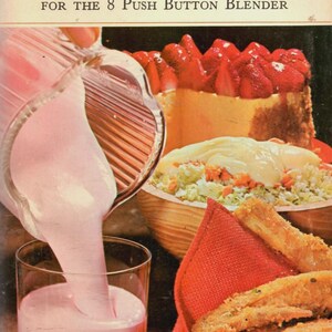 May include: Vintage cookbook cover titled "Waring Cook Book" with the subtitle "For the 8 Push Button Blender." The image shows a pink drink being poured into a glass, alongside a cake topped with strawberries, a salad, and fried food.