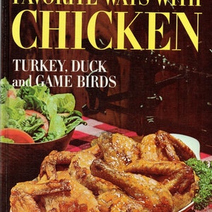 May include: A vintage cookbook cover featuring a close-up of roasted chicken in a red and white casserole dish. The title reads "Favorite Ways With Chicken, Turkey, Duck and Game Birds" in yellow and white text.