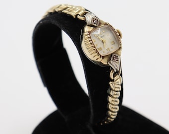 HELZBERG swiss made 10k r.g.p. bezel vintage ladies wrist watch stainless steel. base metal bezel, flex bracelet, with rhinestones