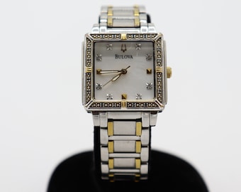 2012's Bulova Women's Watch with rhinestones Two-tone Stainless steel back. Water-resistant. Japan movement