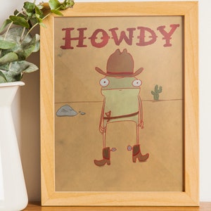Stampa artistica di "Howdy Frog" / Divertente arte murale western / Poster di una rana cowboy / Decorazione di un anfibio stravagante / Regalo di una rana carina / Stampa divertente