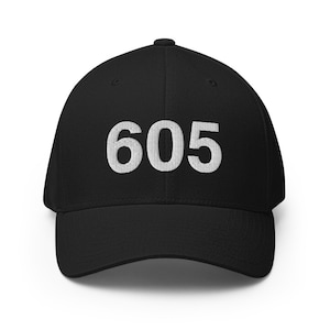 May include: Black baseball cap with the number 605 embroidered in white on the front.