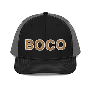 May include: A black and gray trucker hat with a gold embroidered word "BOCO" on the front.