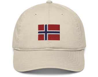 May include: A beige baseball cap with an embroidered Norwegian flag on the front.