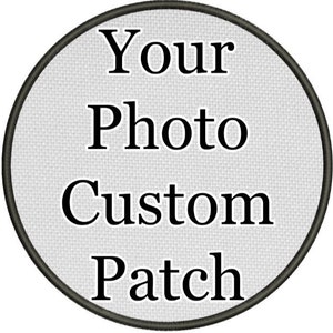 May include: A round, custom patch with the words "Your Photo Custom Patch" in a bold, black font. The text is centered on a light gray, textured background, framed by a dark gray border.