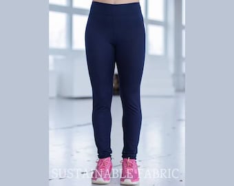 May include: A pair of dark blue leggings with a high waist. The leggings are made of a soft, stretchy fabric and are perfect for yoga, running, or any other type of workout.
