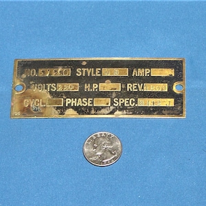 May include: A brass nameplate with the text "NO. 5750 STYLE H.P. AMP. VOLTS 220/240 REV. 1200 CYCL. PHASE SPEC. 115-230-460-575"