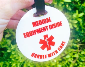 Medical equipment inside - Handle with care tag - Features medical alert symbol