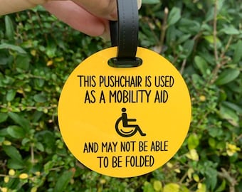 Pushchair is being used as mobility aid - May not be folded Wheelchair Pushchair Autism Awareness Tag