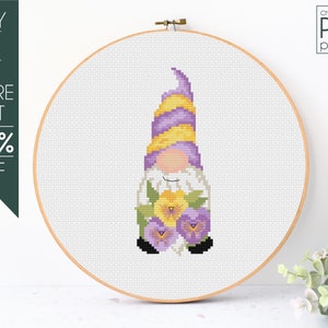 May include: A cross-stitch design featuring a gnome with a purple and yellow hat, white beard, and floral details, presented in a wooden embroidery hoop. Text on the left reads "BUY 2 OR MORE GET 50% OFF". The text "cross-stitch PDF pattern" is in the upper right.