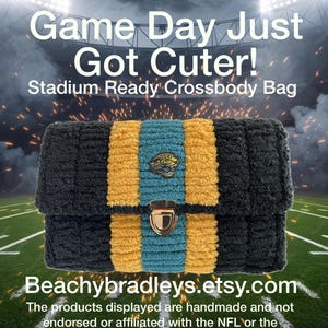 May include: A black and gold stadium-ready crossbody bag with a teal and gold stripe design. The bag features a gold clasp and a Jacksonville Jaguars logo. Text on the bag reads "Game Day Just Got Cuter!" and "Beachybradleys.etsy.com".