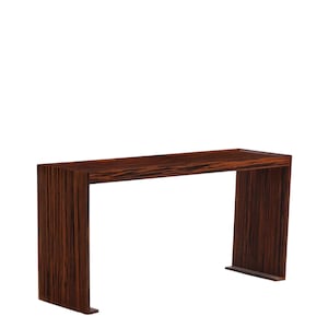 May include: A rectangular console table featuring a dark brown wood grain pattern with vertical and horizontal stripes. The furniture piece has a flat top surface and two side panels that extend to the floor, creating a continuous U-shaped frame.