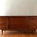 Mid Century Modern Sculpted Walnut Triple Dresser or Credenza by Unagusta 