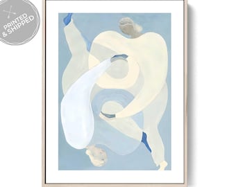 May include: Abstract art print featuring figures in white and light blue hues. The artwork is framed in a light wood tone and set against a pale blue background. The print has a soft, ethereal quality, with the figures appearing to intertwine.