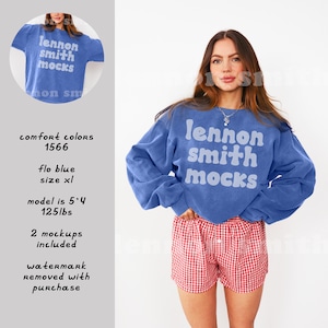 May include: A blue sweatshirt with the text "lennon smith mocks" in white. The model is wearing red and white checked shorts. The sweatshirt is a size XL and the model is 5'4" and 125 lbs.