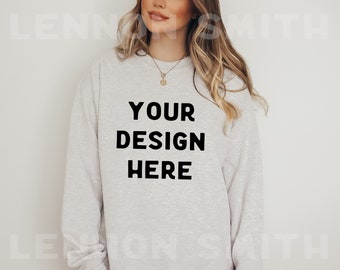 May include: A light gray sweatshirt with the text "YOUR DESIGN HERE" printed in black.