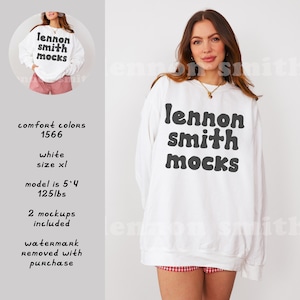 Może przedstawiać: Biała bluza z nadrukiem "lennon smith mocks" w czarnych literach bąbelkowych. Model nosi rozmiar XL.