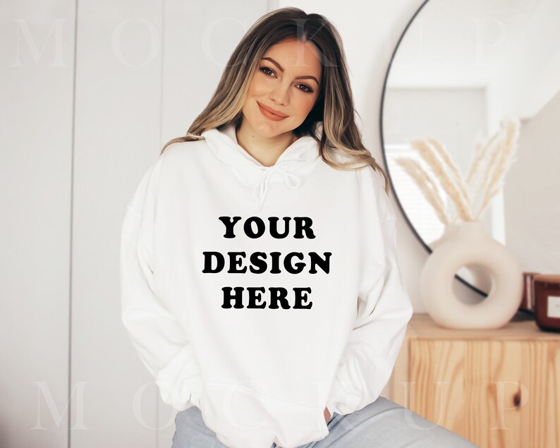 Puede incluir: Sudadera blanca con capucha con el texto "YOUR DESIGN HERE" en negro.