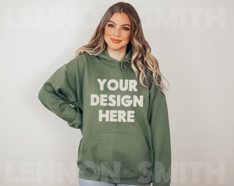 May include: A green hooded sweatshirt with the text "YOUR DESIGN HERE" printed on the front.