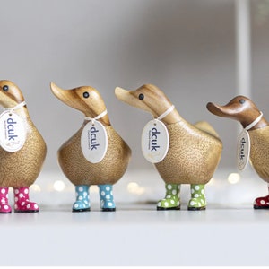 Natural Wood Ducky wearing spotty welly boots