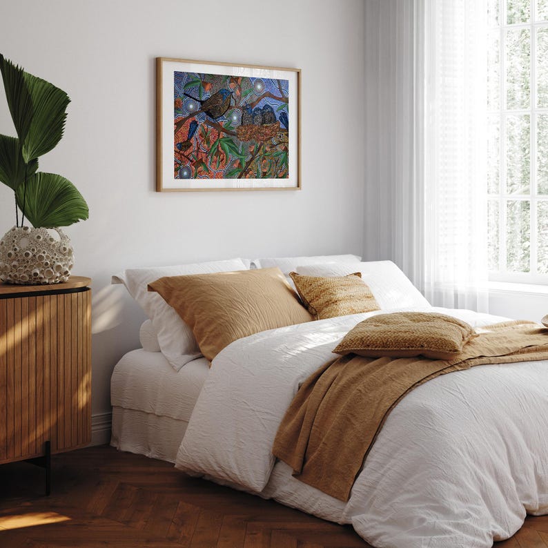 a bedroom with a bed and a painting on the wall