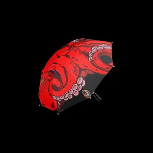 A Red Octopus in the dark depths of the ocean umbrella, designed to inspire diver and other lovers of the sea | Fat Rabbit Network
